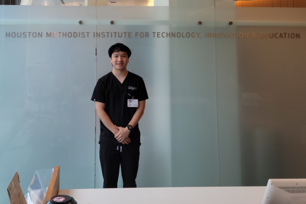 University of St. Thomas student stands within Houston Methodists' MITIE (sm) Center, where he has been an intern.